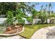 Landscaped backyard with brick pathway and bird bath at 2227 Miguel St, Lakeland, FL 33801