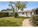 Large backyard with brick pathway and shed at 2227 Miguel St, Lakeland, FL 33801