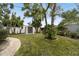 Landscaped backyard with storage shed and brick path at 2227 Miguel St, Lakeland, FL 33801