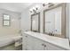 Bathroom with double vanity, large mirrors, and updated fixtures at 2227 Miguel St, Lakeland, FL 33801