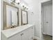 Updated bathroom with double vanity and large mirrors at 2227 Miguel St, Lakeland, FL 33801