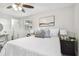 Main bedroom with queen bed, nightstands, and en-suite bathroom access at 2227 Miguel St, Lakeland, FL 33801