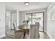 Bright dining area with round table and chairs, leading to a screened porch at 2227 Miguel St, Lakeland, FL 33801