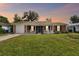 Brick house with a well-maintained lawn and porch at 2227 Miguel St, Lakeland, FL 33801