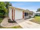 Brick home with white garage door and porch at 2227 Miguel St, Lakeland, FL 33801