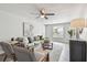 Living room with gray sofa and mid-century modern chairs at 2227 Miguel St, Lakeland, FL 33801