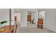 Bedroom featuring a rocking chair, a closet with sliding mirrored doors, and office desk at 4064 River Crest Cir, Leesburg, FL 34748