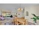 Open dining area with a view of living room and kitchen at 4064 River Crest Cir, Leesburg, FL 34748