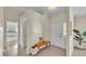 Inviting entryway with a bench and a view to the bedroom and hallway at 4064 River Crest Cir, Leesburg, FL 34748