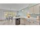 Kitchen with dining nook featuring white cabinets and countertops at 4064 River Crest Cir, Leesburg, FL 34748