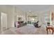 Spacious living room featuring a comfy sofa, armchair, and a large window at 4064 River Crest Cir, Leesburg, FL 34748