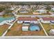 Aerial view of the property featuring a large yard with a screened pool and shed at 555 Lindsey Dr, Lakeland, FL 33809