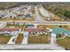 Wide aerial shot showing the property in the neighborhood and surrounding landscape at 555 Lindsey Dr, Lakeland, FL 33809