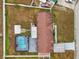 Aerial view of the home, yard, and screened-in pool at 555 Lindsey Dr, Lakeland, FL 33809