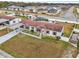 Aerial view of manufactured home with spacious yard and pool at 555 Lindsey Dr, Lakeland, FL 33809