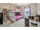Bedroom with bunk beds and a small sofa at 555 Lindsey Dr, Lakeland, FL 33809