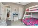 Bedroom with bunk beds and a small sofa at 555 Lindsey Dr, Lakeland, FL 33809