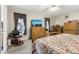 Spacious bedroom with a dresser, TV, and king-size bed at 555 Lindsey Dr, Lakeland, FL 33809