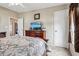 Bedroom with a dresser, TV and double bed at 555 Lindsey Dr, Lakeland, FL 33809