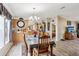 Bright dining room features a wood table with chairs, and views into the kitchen and living room at 555 Lindsey Dr, Lakeland, FL 33809