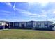 Charming single-story home with a well-kept lawn and a carport at 555 Lindsey Dr, Lakeland, FL 33809