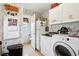Laundry room with washer, dryer, and extra storage at 555 Lindsey Dr, Lakeland, FL 33809