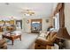Open concept living room and kitchen area with hardwood floors and comfortable furniture at 555 Lindsey Dr, Lakeland, FL 33809