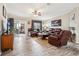 Spacious living room with leather recliners and wood-look flooring at 555 Lindsey Dr, Lakeland, FL 33809