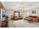 Spacious living room with comfortable leather furniture, hardwood floors, and large windows at 555 Lindsey Dr, Lakeland, FL 33809