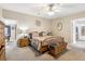 Large main bedroom with wood furniture and ceiling fan at 555 Lindsey Dr, Lakeland, FL 33809
