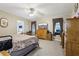 Spacious main bedroom with a dresser and a TV at 555 Lindsey Dr, Lakeland, FL 33809