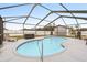 Inviting kidney-shaped pool with screened enclosure at 555 Lindsey Dr, Lakeland, FL 33809