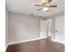 Spacious bedroom with wood floors, ceiling fan, and two closets at 942 Hanover Ave, Winter Park, FL 32789