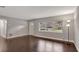 Spacious living room featuring hardwood floors and lots of natural light from the window at 942 Hanover Ave, Winter Park, FL 32789