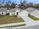 Single-story house with driveway and landscaped yard at 1976 Thompson Preserve Blvd, Bartow, FL 33830