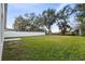 Large backyard with grassy area and privacy fence at 1976 Thompson Preserve Blvd, Bartow, FL 33830