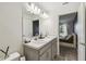 Modern bathroom with double vanity and view of bedroom at 1976 Thompson Preserve Blvd, Bartow, FL 33830