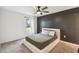 Spacious bedroom with ceiling fan and large window at 1976 Thompson Preserve Blvd, Bartow, FL 33830