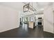 Bright dining room with dark tile floors and modern light fixture at 1976 Thompson Preserve Blvd, Bartow, FL 33830