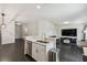 Modern kitchen with island, stainless steel appliances, and dark floors at 1976 Thompson Preserve Blvd, Bartow, FL 33830