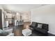 Open living room with dark tile floors and modern furniture at 1976 Thompson Preserve Blvd, Bartow, FL 33830