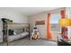 bedroom with bunk beds, teepee, and orange curtains at 3210 Armstrong Ave, Clermont, FL 34714