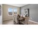 Bright dining room featuring a wood table and six chairs, with views of the neighborhood at 3210 Armstrong Ave, Clermont, FL 34714