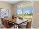 Dining area with a live edge wood table and sliding glass doors leading to the backyard at 3210 Armstrong Ave, Clermont, FL 34714