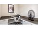 Home office with L-shaped desk and modern decor at 3210 Armstrong Ave, Clermont, FL 34714