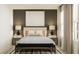 Main bedroom with a neutral color palette, nightstands, and a bench at the foot of the bed at 2732 Pioneer Trl, Eagle Lake, FL 33839