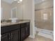 Bathroom with granite countertop and shower at 305 Captiva Dr, Davenport, FL 33896