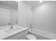 Clean bathroom with white bathtub and tiled walls at 310 Amberjack Ln, Poinciana, FL 34759