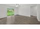 Bedroom with wood-look flooring, sliding glass door to backyard at 310 Amberjack Ln, Poinciana, FL 34759