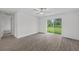 Bedroom with wood-look flooring, sliding glass door to backyard at 310 Amberjack Ln, Poinciana, FL 34759